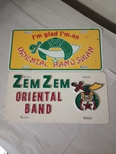 Vintage Zem Zem Oriental Band Metal & Plastic Vanity License Plate Lot (2)