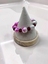 Colorful pink and red beaded stretch bracelet