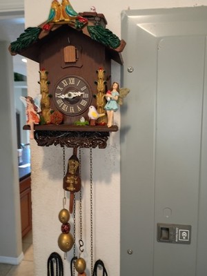 Vintage fiary cuckoo clock baby bird pops out chimny, lady bird pendulum.WORKING