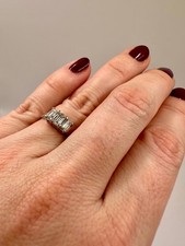 Emerald cut diamond trilogy ring