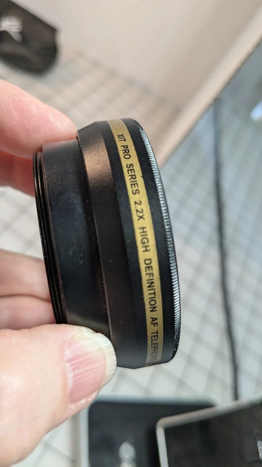 XIT Photo Lens Wallet/52 mm/4 Xit Close-up/ 1 Hoya Filter/1 Nikon EH-69P Charger - Image 3 of 4