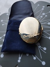 Joli miroir Christian Dior doré authentique pas utiliser avec sa pochette