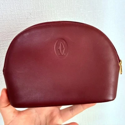 Logo pochette en cuir bordeaux authentique Must de Cartier fabriqué en Espagne - Photo 1/4