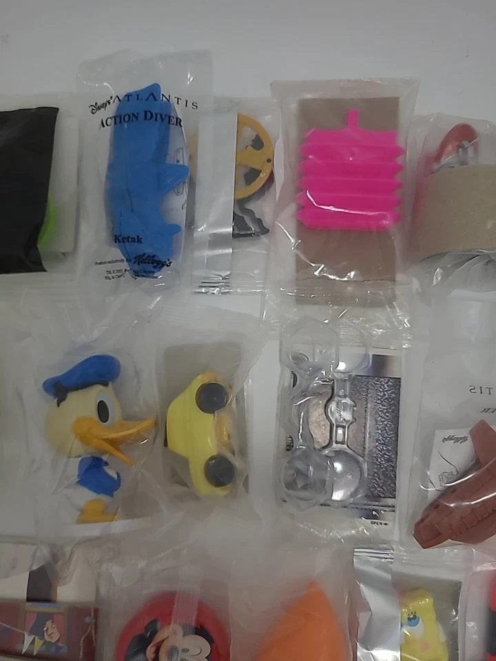 LOTE MIXTO DE COLECCIÓN DE 50 PRIMAS/JUGUETES DE CEREALES SELLADOS Kellogg’s-Disney Etc. ++ Foto 3 de 4