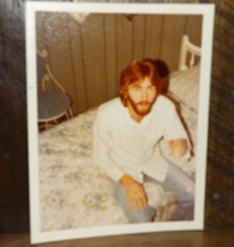 Found color Snapshot-Bearded man pointing at the camera