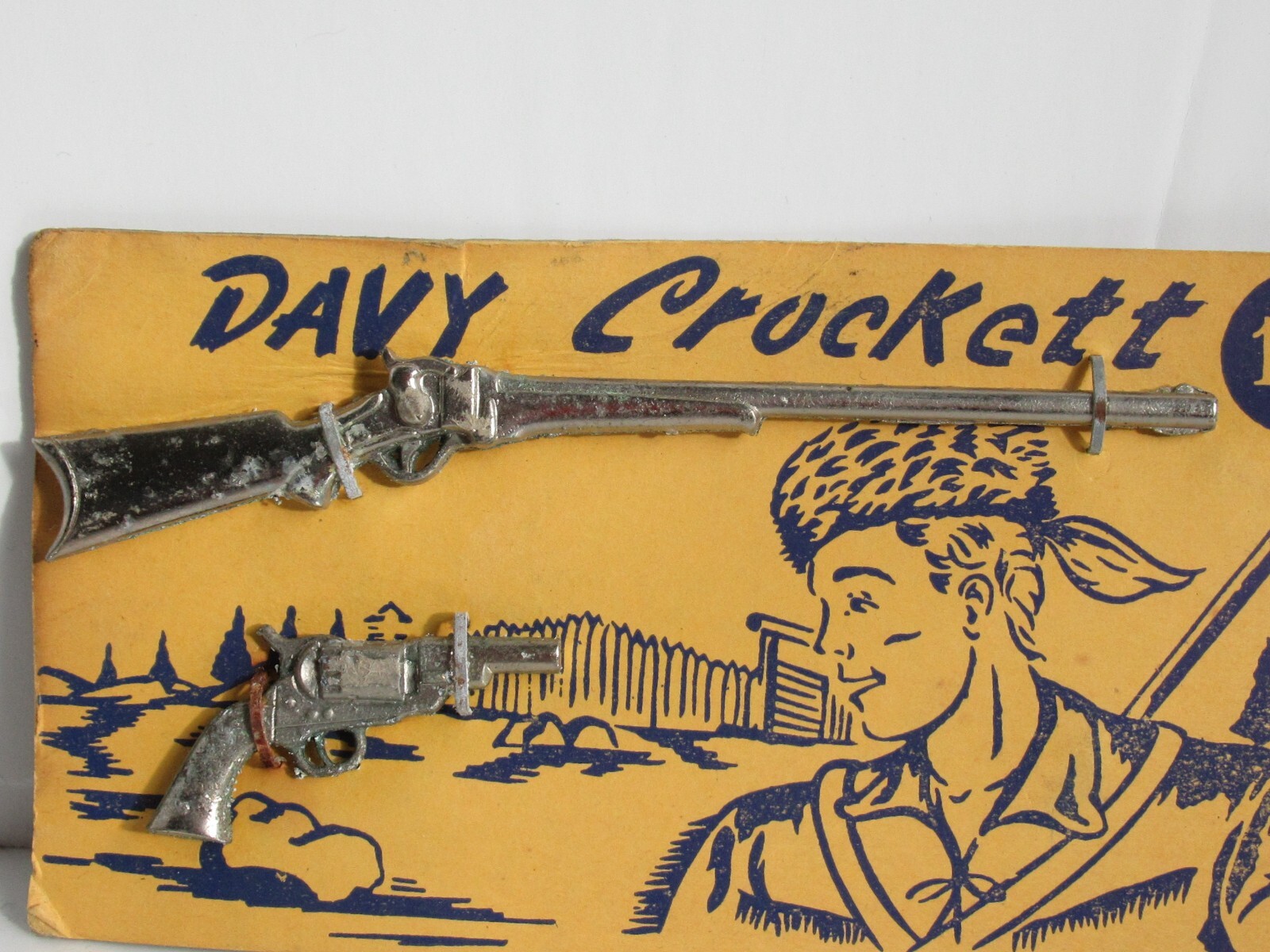 VINTAGE DAVY CROCKETT SMALL TOY METAL GUN RIFLE ON ORIGINAL CARD MARKED