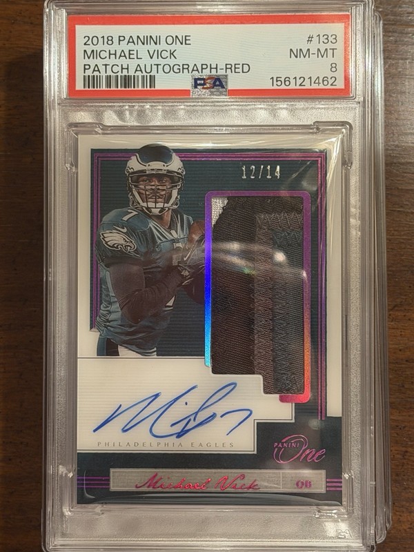 2018 Panini One - Patch Autographs Michael Vick #133 Red /14 (AU, MEM) Game Worn
