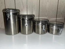 Oggi 4-Piece Stainless Steel Canister Set with Acrylic Lid and Clamp-Set Incl...