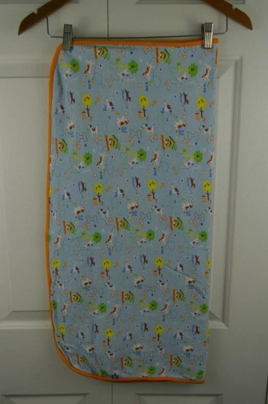 Manta para bebé Zutano cachorro perro azul naranja casa para perros hueso buscar sentarse permanecer seguridad Foto 3 de 4