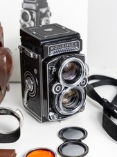 Rolleiflex 2.8f planar Extra's Lens Hood, Filter, Case and Book