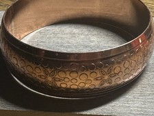 Solid Copper Bangle 7/8 Of An Inch wide. Will fit a 6 1/2 to 7 inch wrists.