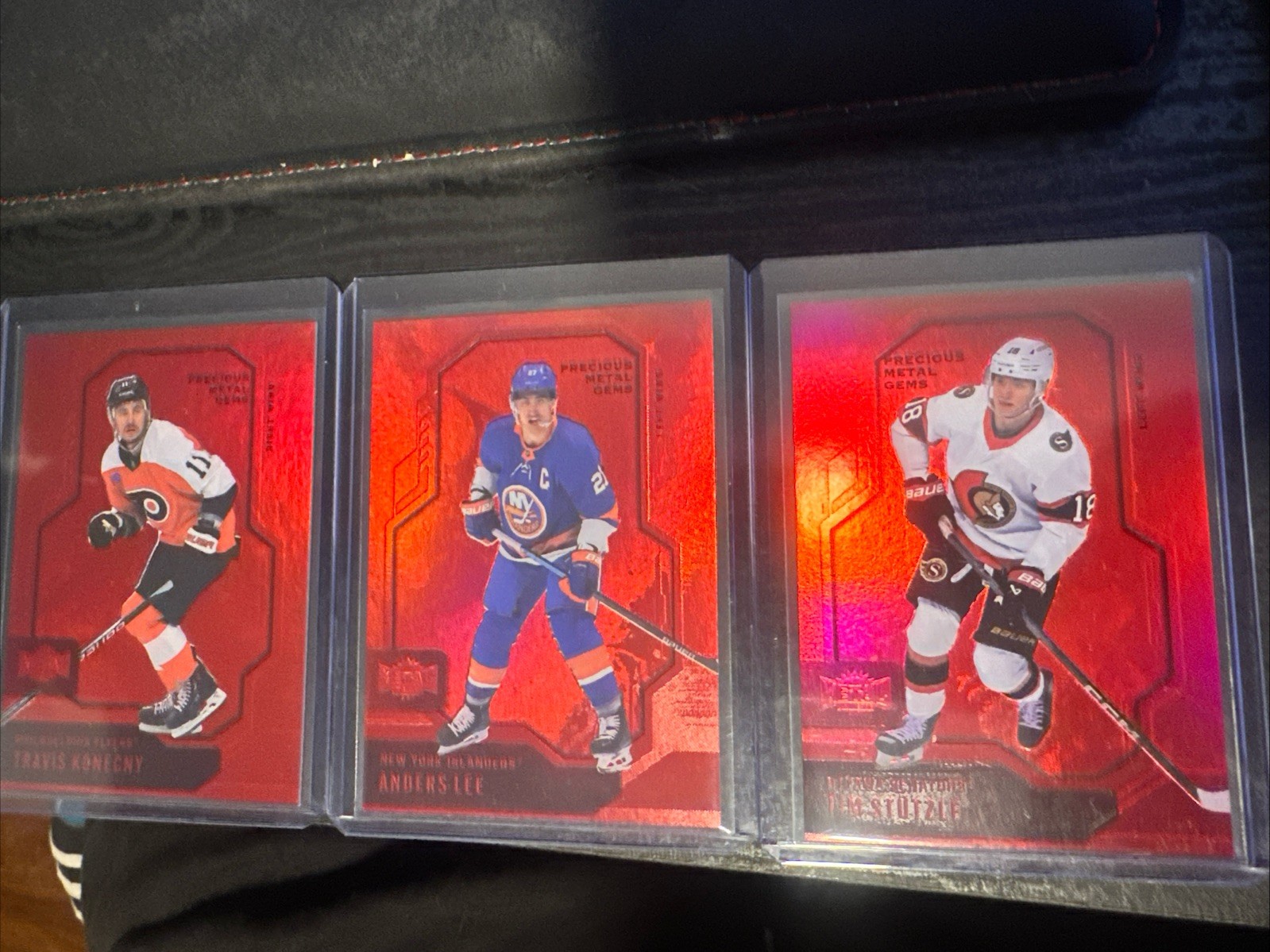 Tim Stutzle, Anders Lee, Travis Konecny Red Pmg Lot 2024-2025 Metal Universe