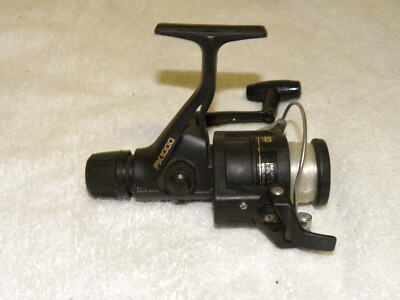 SHIMANO FX 1000 SPINNING REEL- VERY NICE-REAR DRAG-QUICK