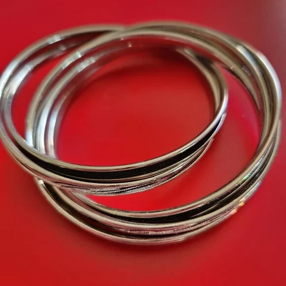 Designer Silvertone Intertwined Bangle Bracelets - image 1