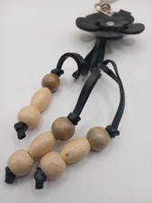 boho-style keychain black leather flower charm with light wood beads