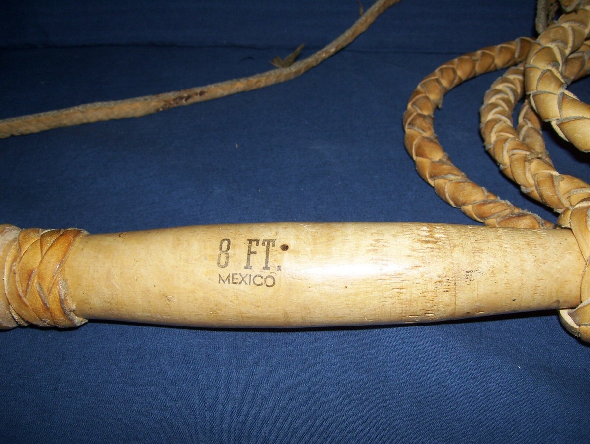 A Vintage Wooden and Leather Whip A Vintage Wooden and Leather Whip
