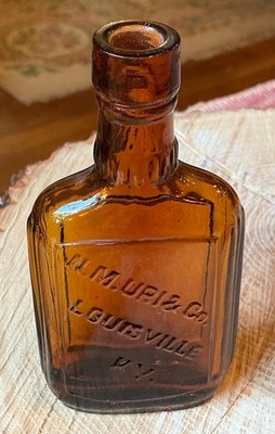PRE-PRO LOUISVILLE, KY. N.M. URI & CO. WHISKEY SAMPLE, AMBER BOLD EMBOSS MINT 4 