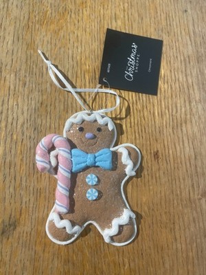 Gingerbread Man Ornament with Some Sprinkle Holding Striped Candy Cane