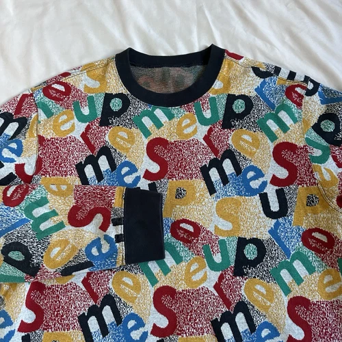 Pull homme Supreme texte dispersé col rond