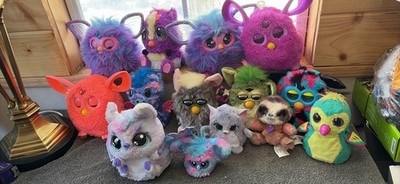 A Bunch Of Battery Operated Furbies And Other Different Ones