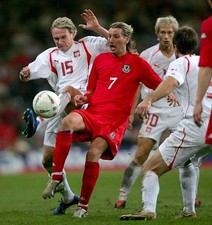 Robbie Savage of Wales is challenged by Sebastian Mila of Poland d- Old Photo