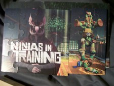 TEENAGE MUTANT NINJA TURTLES SET OF 7 PUZZLES IN WOOD BOX