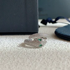 APM monaco green snake ring features an open end design, is fully diamond