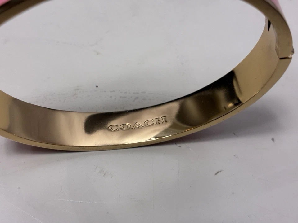 $125 COACH New York Signature Gold/Pink Enamel Push Hinged Bangle Bracelet Sz 7 - Image 2 of 4