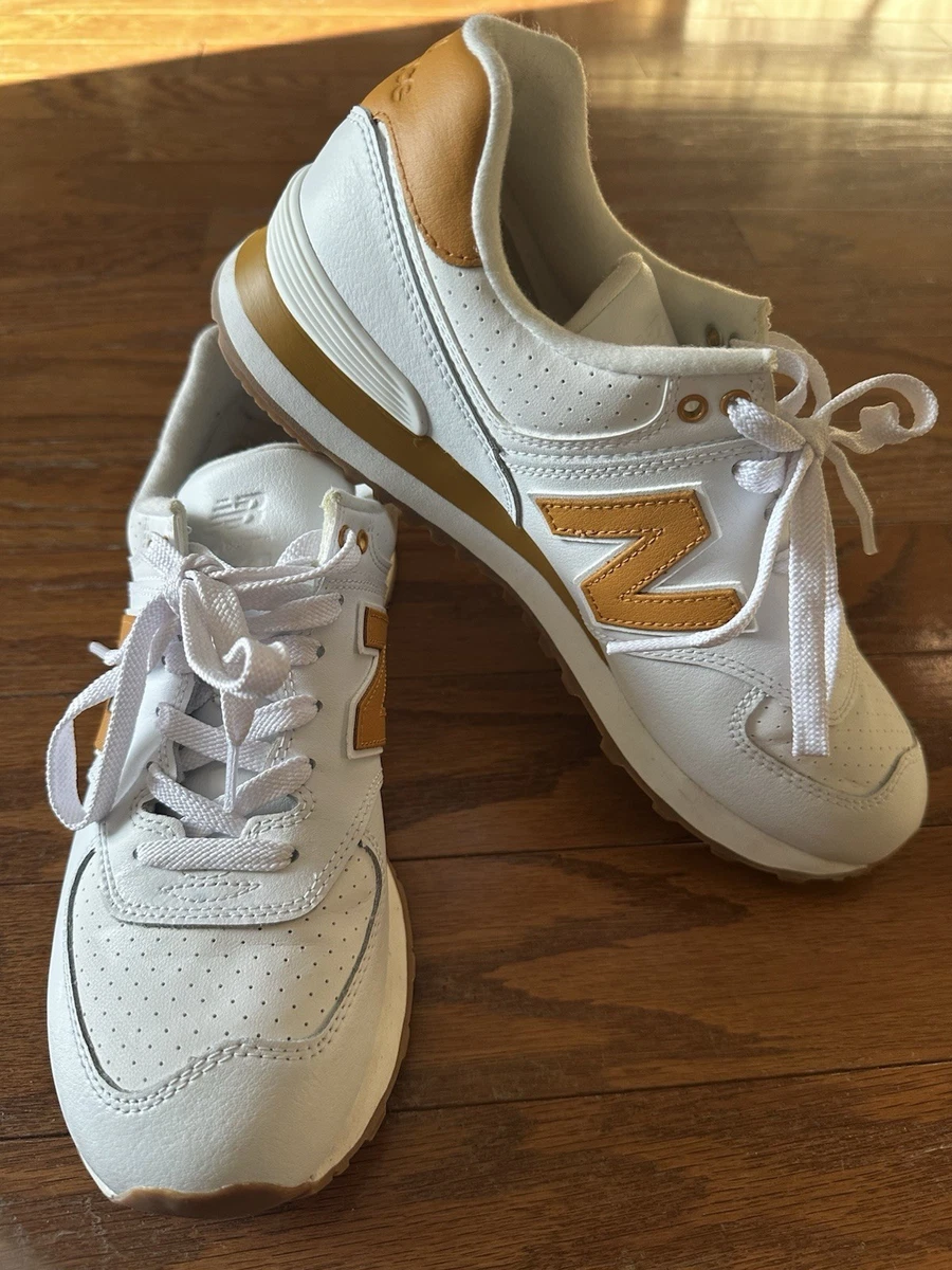 Preços baixos em Tênis Esportivo New Balance 574 Ouro para