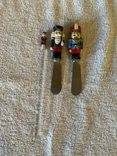 Lot 56 - Vintage (2) Nutcracker Cheese Spread Knives & Plastic Drink Stirrer
