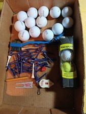 Assortment Of Golf Balls And Golf Accessories