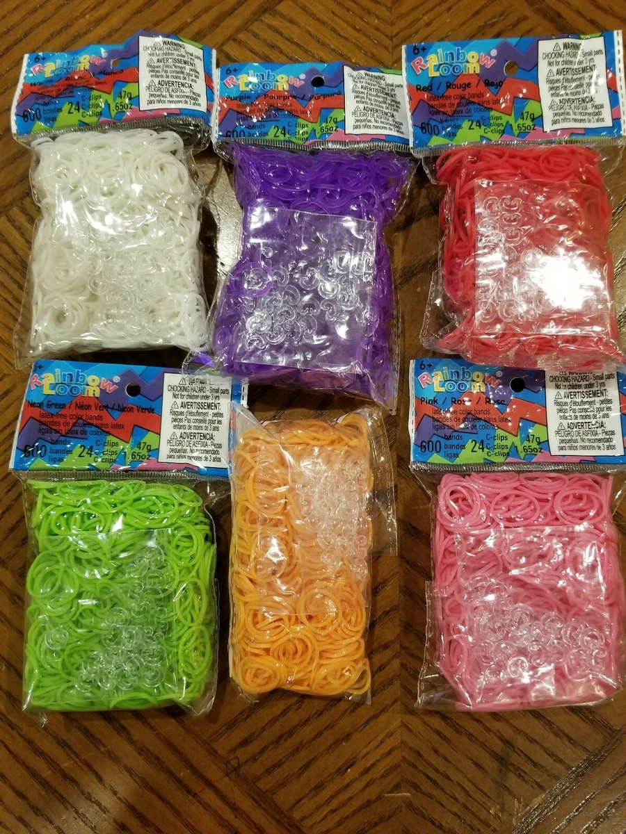 Rainbow loom bands in purple, white, neon orange, neon green, pink