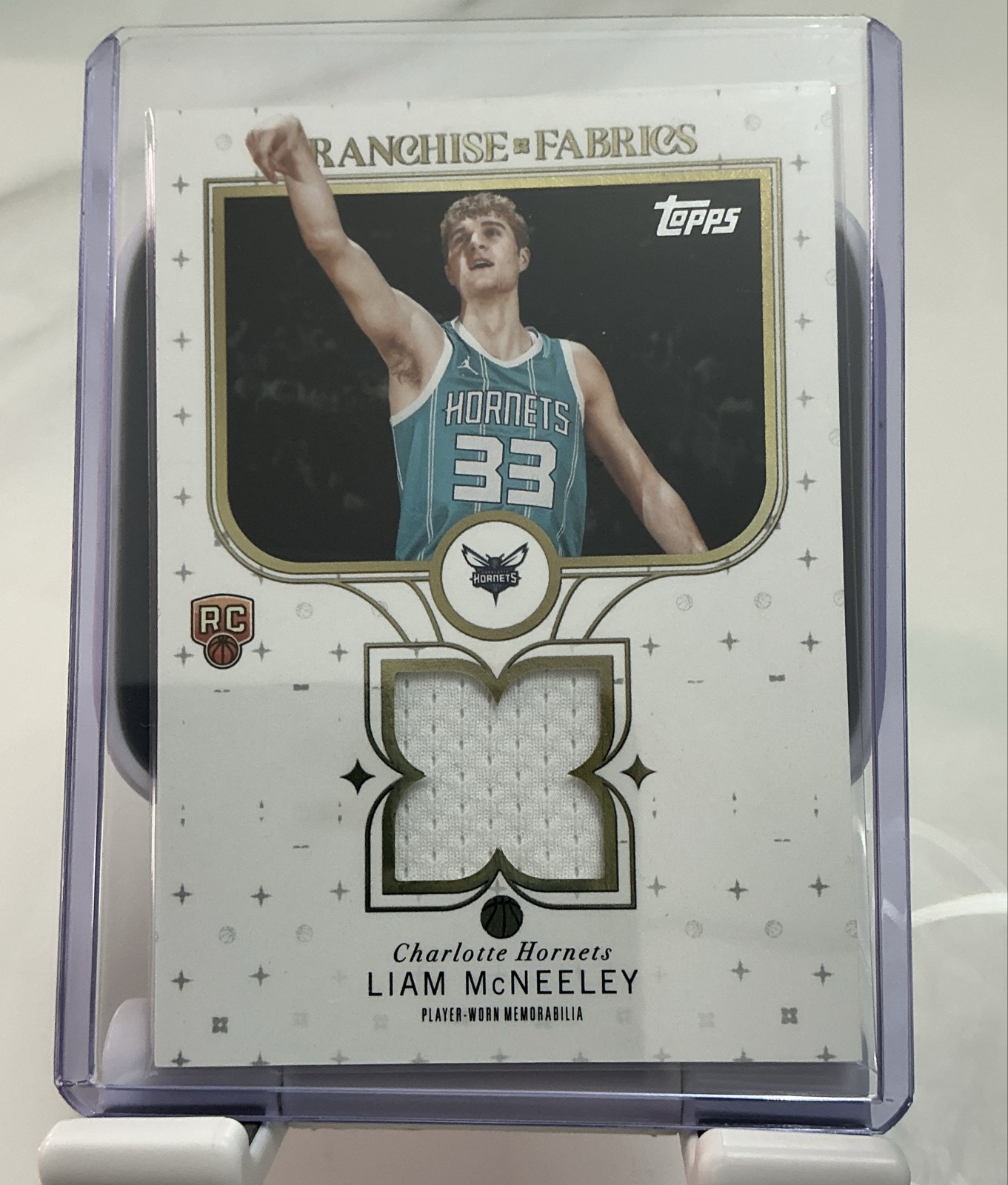 2025-26 Topps - Franchise Fabrics Liam McNeeley #FF-LM (MEM, RC)