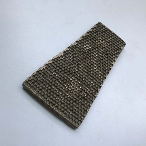 An antique old bell metal jewelry stamp die seal, small holes.