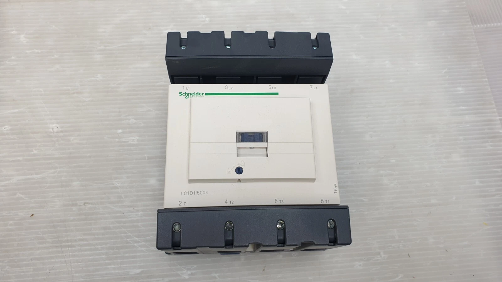 Front of the LC1D115004 TeSys D contactor with terminals L1-L4 and T1-T4