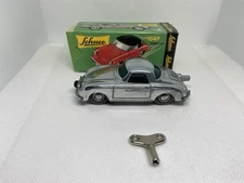 Schuco- Micro Racer 1047-porsche #0059-chrome color- with replacement key-