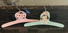 Set Of 2 Vintage Children’s Pink & Blue Painted W/ Face & Hats Wood Hangers 11"