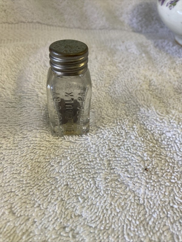 Antique Dental Fillings Bottle embossed half ounce caulk 20th century. Fillings