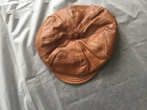 brown cabbie hat