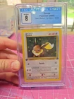 Eevee 55/82 Team Rocket Regular CGC 8