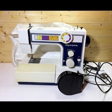 Toyota 2400 Electric Sewing Machine White with Foot Pedal and Slip Cover Case