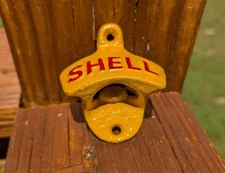 CAST IRON SHELL OIL GASOLINE BOTTLE OPENER! WALL MOUNT ADVERTISING BEER SODA POP