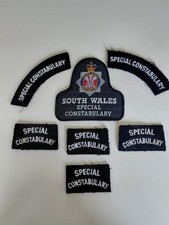 Obsolete South Wales Special Constabulary Cloth Bell Badge with extra badges 