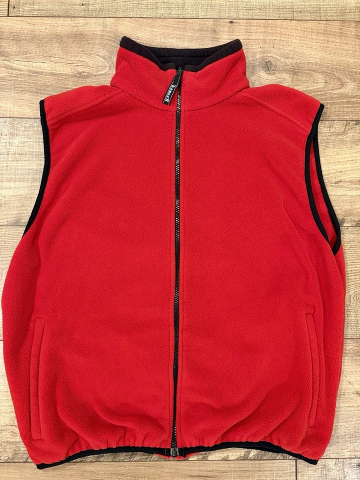 A genuine 80s ski vest from Marker — the brand known for ski bindings — in classic red and black fleece that oozes retro slope style.