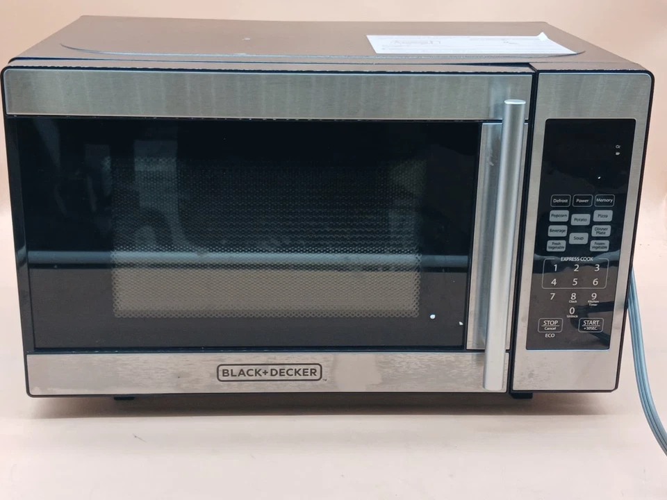 Horno microondas encimera BLACK+DECKER 0,7 pies cúbicos - Acero inoxidable - Usado Foto 2 de 4