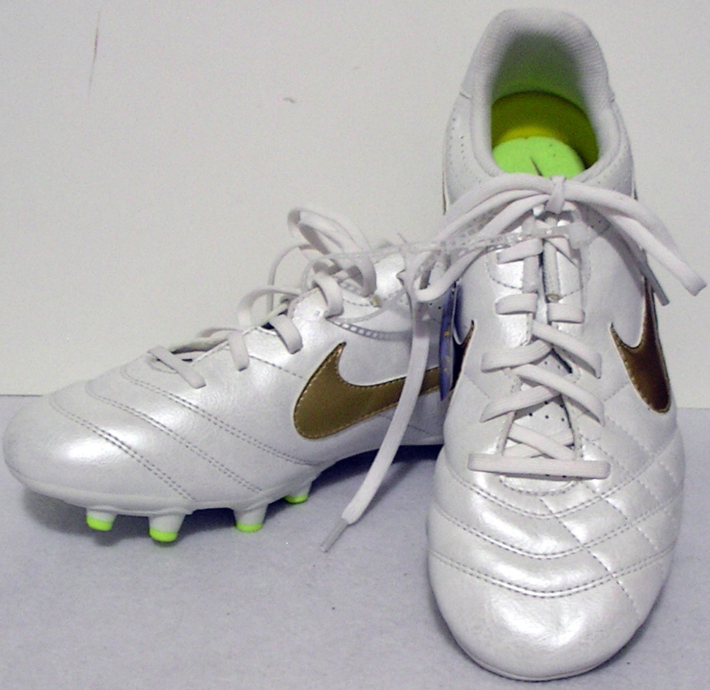 white and gold nike soccer cleats