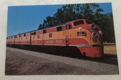 A Trio Of E.M.D. E-7 Diesel Units Lead Southern Pacific Train # 10. PC (M2)