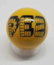 PEZ Yellow Glass 1" Logo Marble w/ Stand
