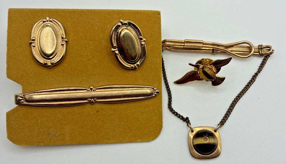 A curated mid-century gold-tone cufflinks and tie bar set that brings genuine Mad Men energy — the kind of accessories you can't find new anymore.