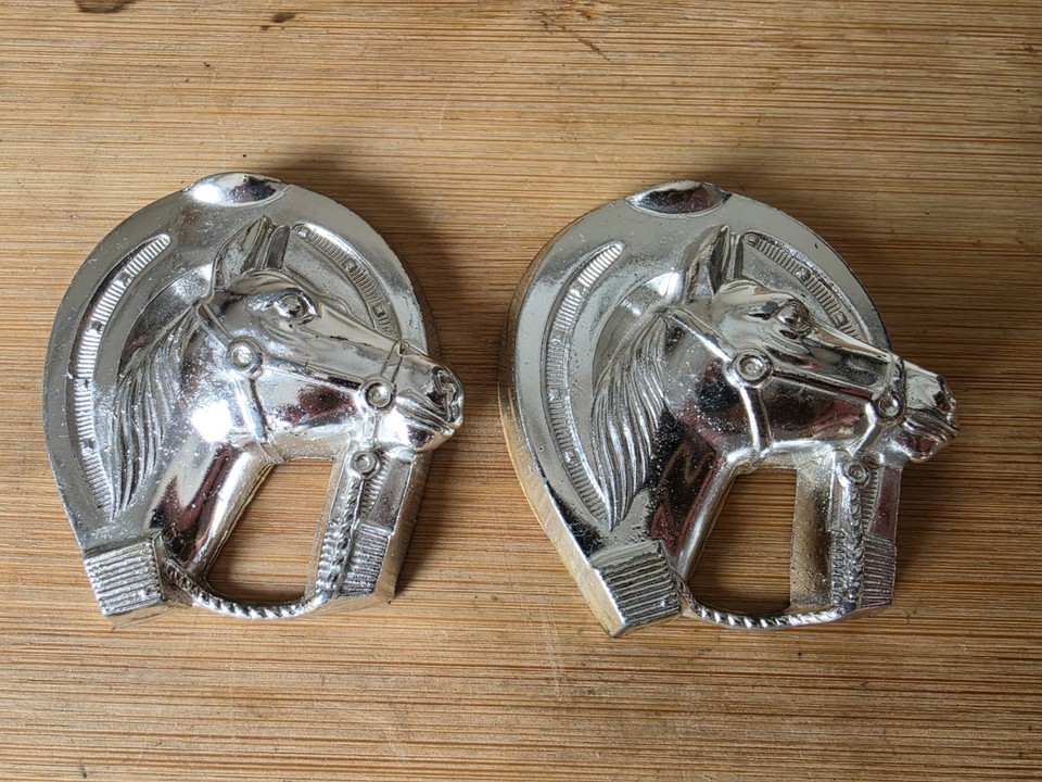A PAIR of solid chrome horse-head bottle openers from 1950s Japan — sculptural, mid-century cool, and actually useful.
